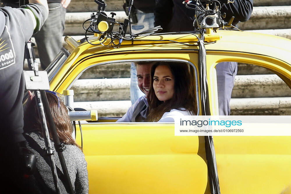 Actor Tom Cruise and actress Hayley Atwell in a Fiat yellow 500 driven by a stuntman, during a an action scene on the set of the film Mission Impossible 7 at Spagna square, just under the Spanish steps. Rome (Italy), November 22nd 2020 Photo Samantha Zucchi Insidefoto SamanthaxZucchi