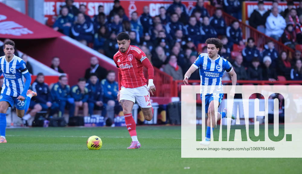 Morgan Gibbs-White of Nottingham Forest runs with the ball under pressure from Ferdi Kadioglu of Brighton & Hove Albion during the Premier league football match between Nottingham Forest and Brighton Hove Albion at City Ground in Nottingham.