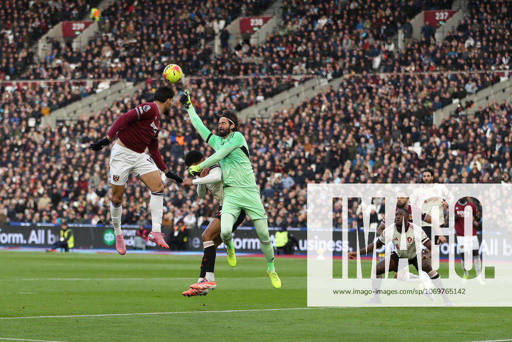 30th November 2025; London Stadium, London, England; Premier League Football, West Ham United versus Liverpool; goalkeeper Alisson Becker of Liverpool punches an incoming cross clear while colliding with Joe Gomez resulting in the match being stopped and physios coming on for treatment KatiexChan