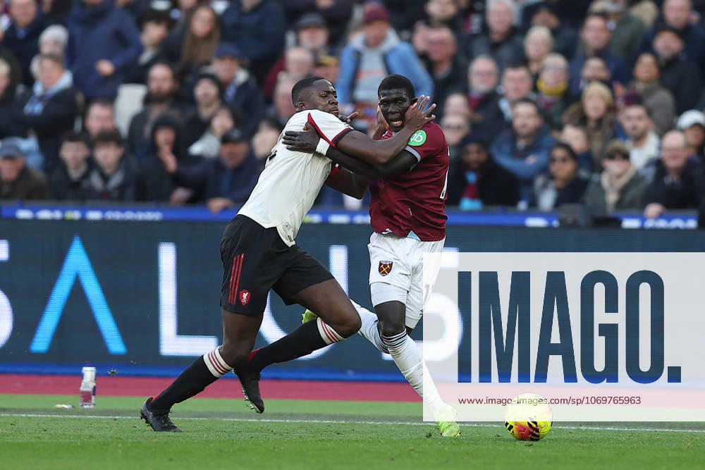30th November 2025; London Stadium, London, England; Premier League Football, West Ham United versus Liverpool; Ibrahima Konate of Liverpool and El Hadji Malick Diouf of West Ham United hold onto each other while competing for the ball KatiexChan