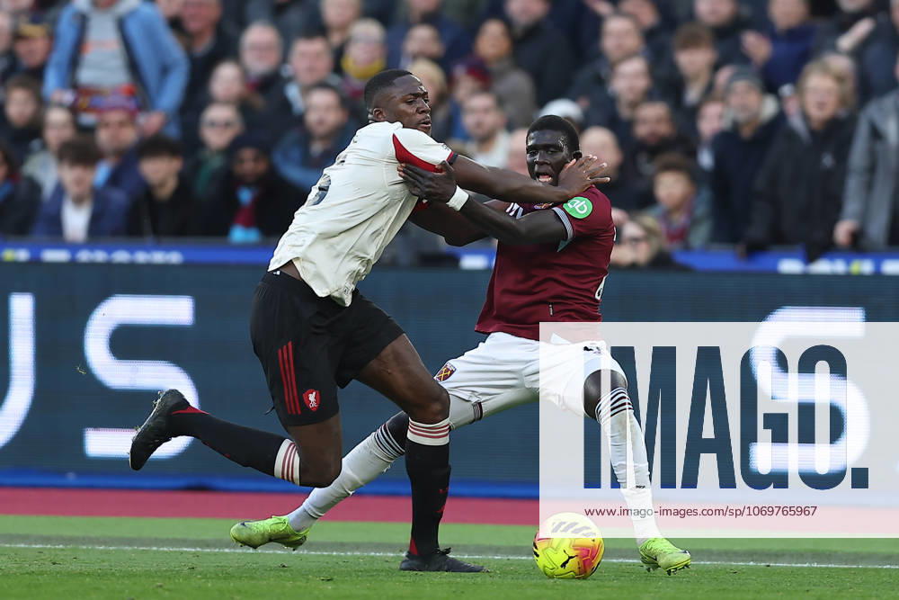 30th November 2025; London Stadium, London, England; Premier League Football, West Ham United versus Liverpool; Ibrahima Konate of Liverpool and El Hadji Malick Diouf of West Ham United hold onto each other while competing for the ball with Ibrahima Konate winning out to the displeasure of West Ham United fans that no foul is given KatiexChan