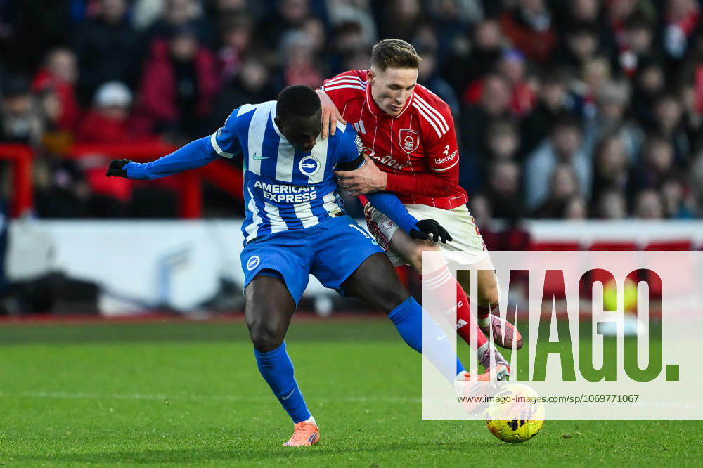 Nottingham, England, 30th November 2025. Yankuba Minteh of Brighton is tackled by Elliot Anderson of Nottingham Forest during the Nottingham Forest vs Brighton and Hove Albion Premier League match at the City Ground, Nottingham. Picture credit should read: Craig Thomas Sportimage . SPI_055_CT_Nottingham_Forest_vs_Brighton_and_Hove_Albion SPI-4337-0066