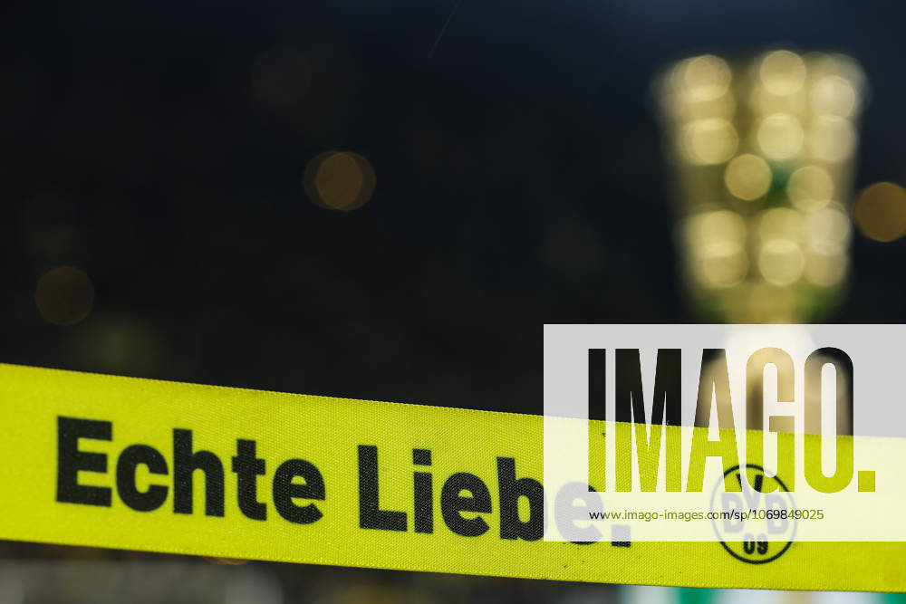 Soccer DFB Cup Borussia Dortmund Bayer 04 Leverkusen on 02 12 2025 at the Signal Iduna Park in Dortmund DFB Pokal Trophy Trophy in the background in front the lettering Echte Liebe and with BVB logo feature, symbol, symbolic photo, characteristic, detail MH