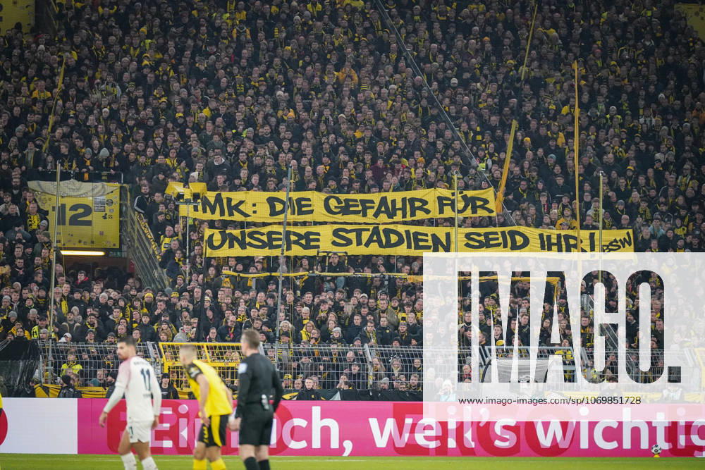 Germany Football DFB Cup 2025 26, Round of 16 Borussia Dortmund vs Bayer 04 Leverkusen Signal Iduna Park Dortmund Large protest banner of BVB fans IMK The danger for our stadiums is you Topics Conference of Interior Ministers, stadium security, fan protests, fan culture, political debate, security policy, transparency, soccer society, Bundesliga, home match crowd, emotional south stand, expression of opinion, public discussion, sports politics, social tensions Dortmund North Rhine-Westphalia Germany