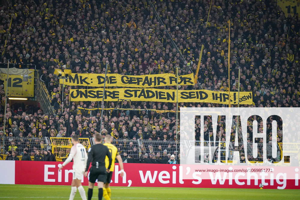 Germany Football DFB Cup 2025 26, Round of 16 Borussia Dortmund vs Bayer 04 Leverkusen Signal Iduna Park Dortmund Large protest banner of BVB fans IMK The danger for our stadiums is you Topics Conference of Interior Ministers, stadium security, fan protests, fan culture, political debate, security policy, transparency, soccer society, Bundesliga, home match crowd, emotional south stand, expression of opinion, public discussion, sports politics, social tensions Dortmund North Rhine-Westphalia Germany