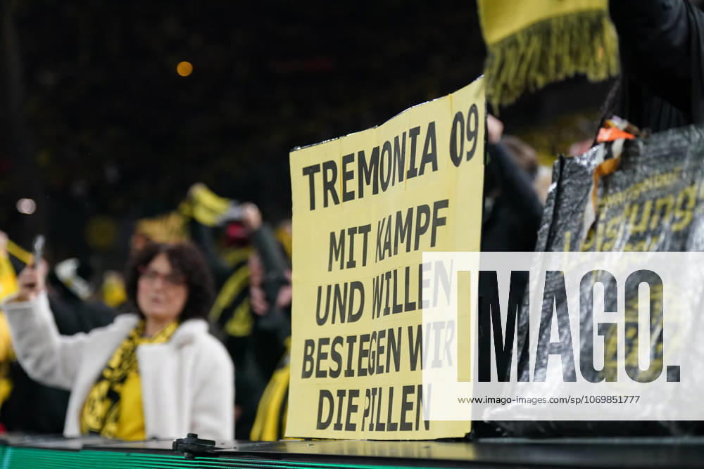 Germany Football DFB Cup 2025 26, Round of 16 Borussia Dortmund vs Bayer 04 Leverkusen Signal Iduna Park Dortmund BVB fans with handmade yellow poster Tremonia 09 With fight and will we defeat the pills, emotional fan culture, derby rivalry, Bayer Leverkusen pills, support of the team, Bundesliga, stadium atmosphere, fan block, passion, club identity, soccer tradition, spectator emotions, media attention Dortmund North Rhine-Westphalia Germany
