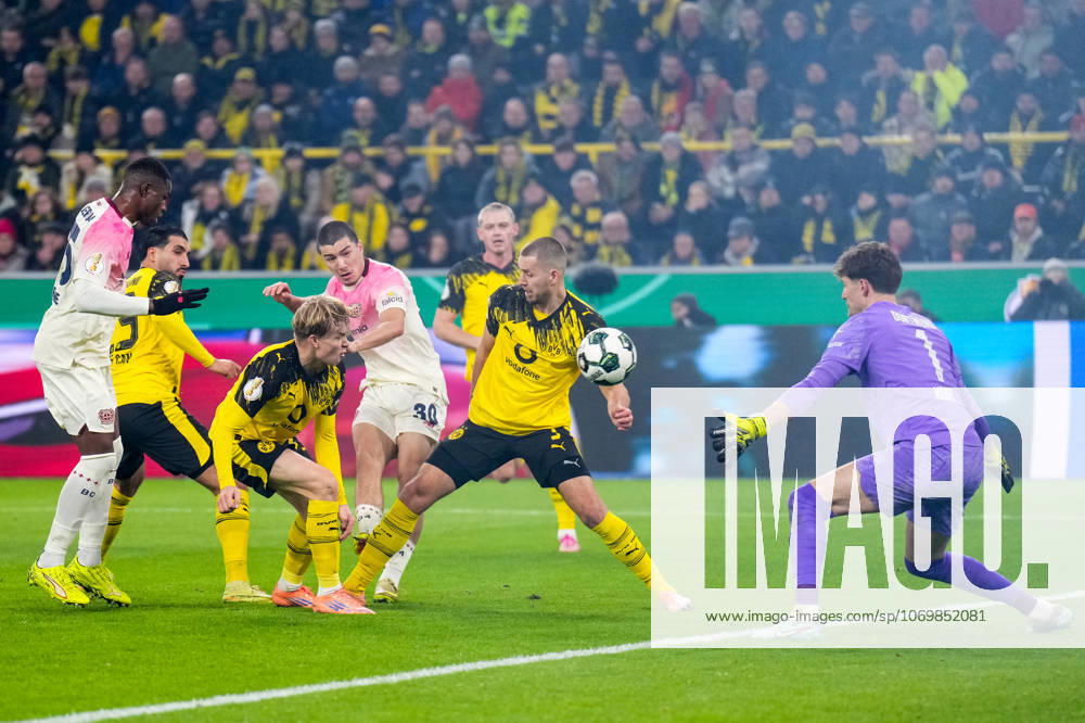 Ibrahim Maza of Bayer 04 Leverkusen shoots to score his team s first goal past Borussia Dortmund goalkeeper Gregor Kobel during the DFB Cup round of 16 match between Borussia Dortmund and Bayer 04 Leverkusen at Signal Iduna Park on December 2, 2025 in Dortmund, Germany. (Photo by Rene Nijhuis) SPO