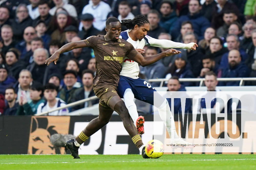 Tottenham Hotspur v Brentford, Premier League Michael Kayode of Brentford and Djed Spence of Tottenham Hotspur battling for the ball during the Tottenham Hotspur v Brentford Premier League match at the Tottenham Hotspur Stadium, London, England on 6 December 2025 Credit: Dylan Hepworth Every Second Media Editorial use only. All images are copyright Every Second Media Limited. No images may be reproduced without prior permission. All rights reserved. Premier League and Football League images are subject to licensing agreements with Football DataCo Limited. see https: www.football-dataco.com
