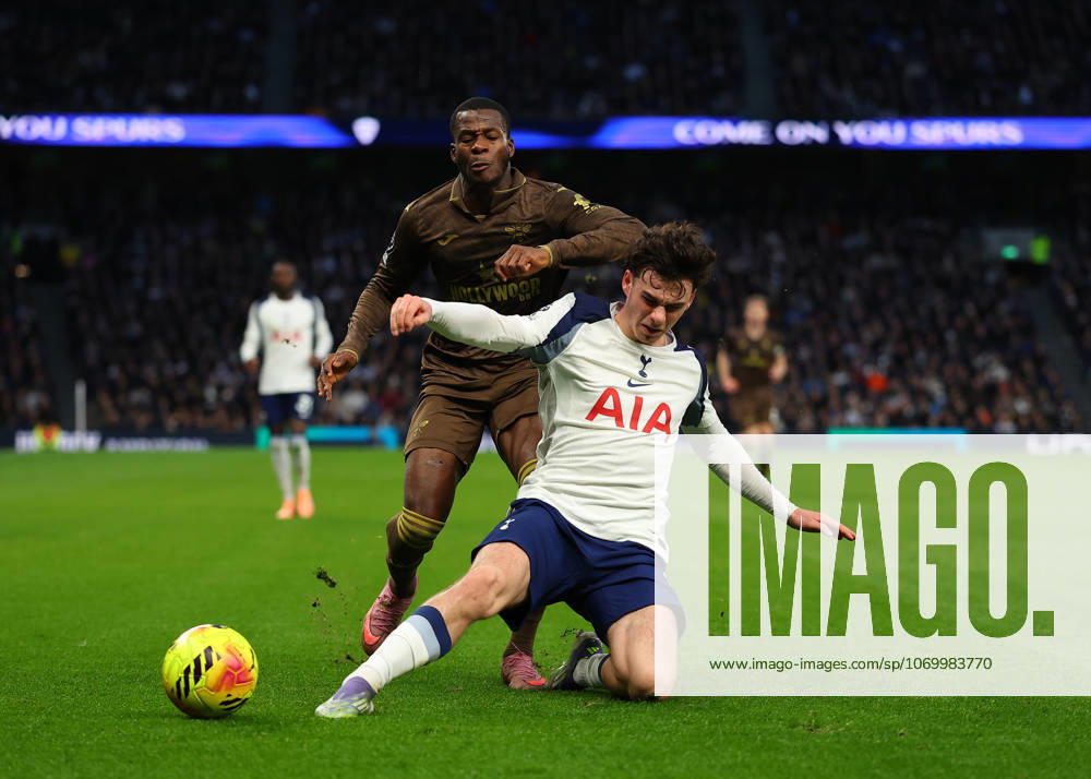6th December 2025; Tottenham Hotspur Stadium, London, England; Premier League Football, Tottenham Hotspur versus Brentford; Michael Kayode of Brentford tackled by Archie Gray of Tottenham Hotspur JohnxPatrickxFletcher