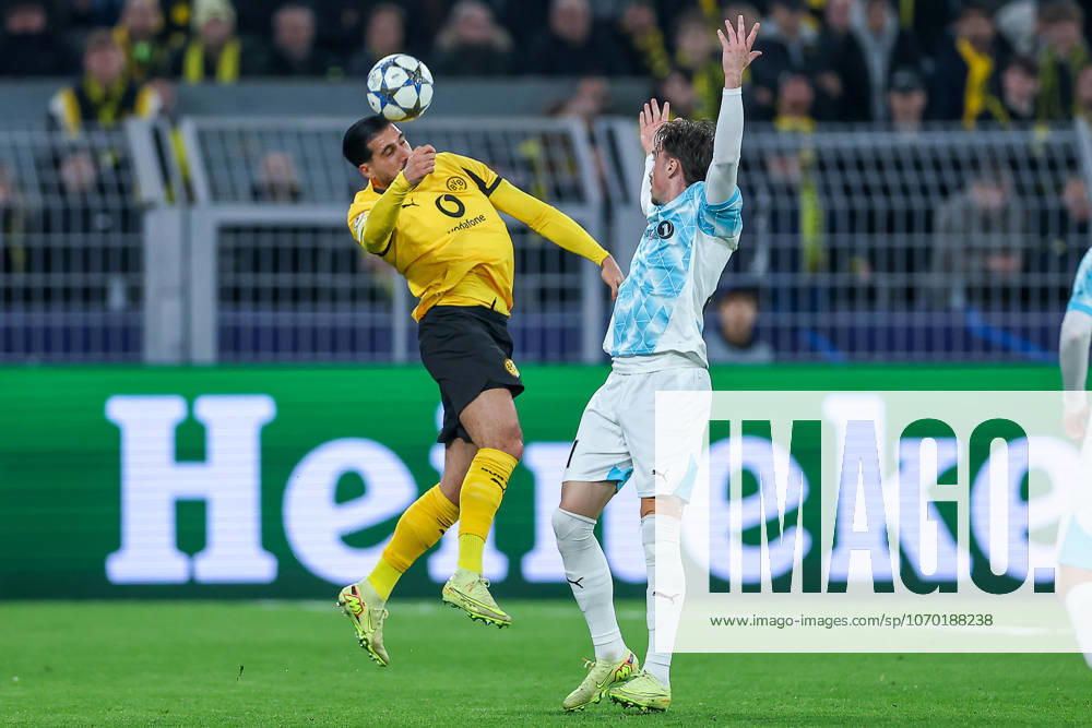 Football, UEFA Champions League, Borussia Dortmund FK Bodö Glimt, BVB Stadion, Matchday 5, Season 2025 2026 Ramy Bensebaini BVB 05 header in duel against Andreas Helmersen Bodo Glimt 21 Regulations prohibit any use of photographs as image sequences and or quasi video North Rhine-Westphalia Germany