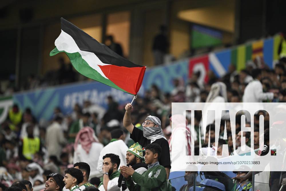 Palestine v Saudi Arabia - 2025 FIFA Arab Cup LUSAIL, QATAR – DECEMBER 11: Supporter of Palestine waves the Palestinian flag during their 2025 FIFA Arab Cup quarterfinal match between Palestine and Saudi Arabia at Lusail Stadium in Lusail, Qatar on December 11, 2025. Stringer Anadolu Lusail Qatar. Editorial use only. Please get in touch for any other usage.