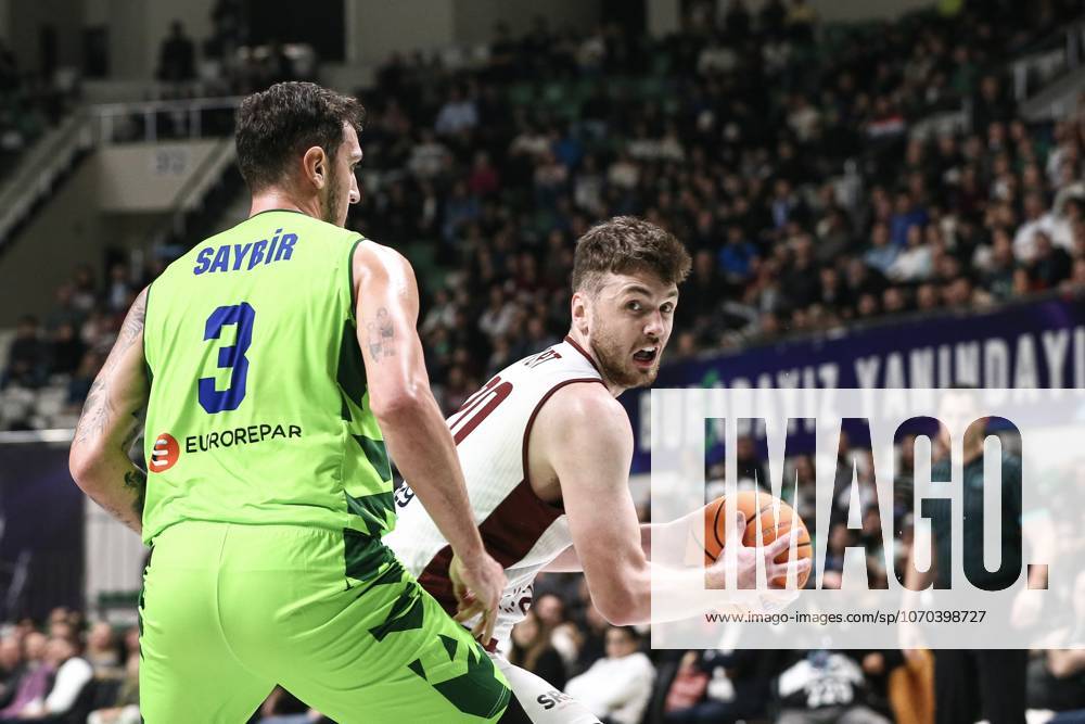 TOFAS v Trapani Shark - Basketball Champions League BURSA, TURKIYE - DECEMBER 16: Hurt (R) of Trapani Shark in action against Yigitcan Saybir (L) of TOFAS during Basketball Champions League Group D week 6 match between TOFAS and Trapani Shark at Tofas Sports Hall in Bursa, Turkiye on December 16, 2025. Saliha Nur Koksal Anadolu Bursa Turkey. Editorial use only. Please get in touch for any other usage.