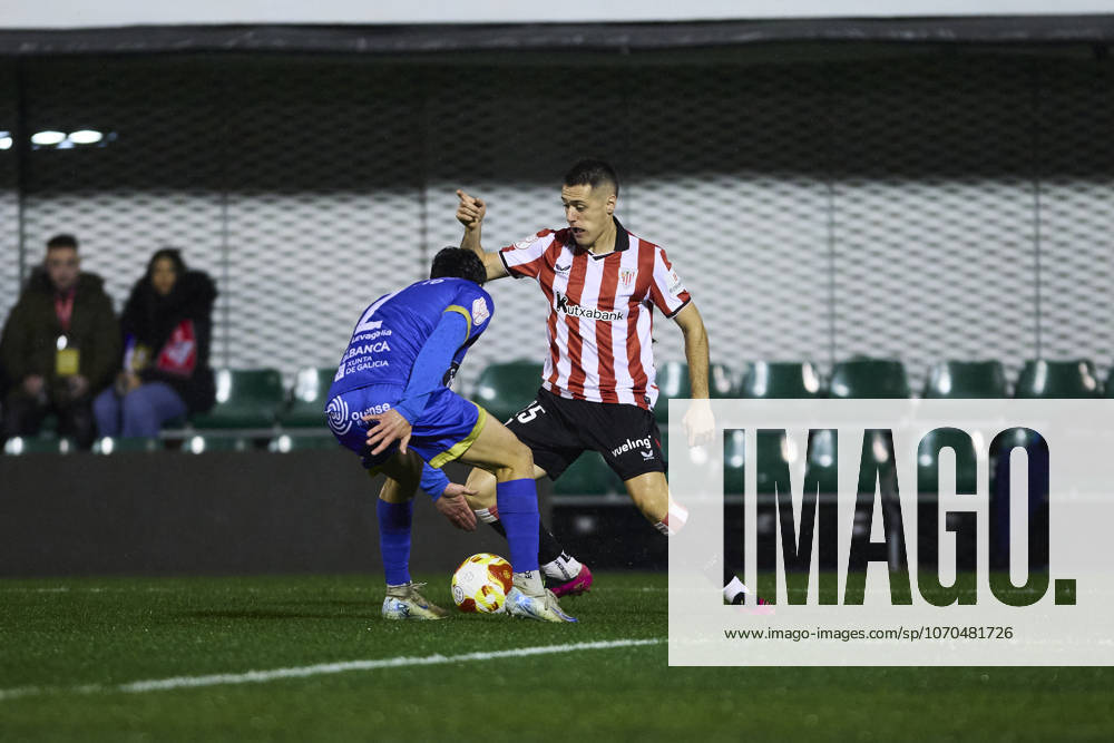 Ourense CF v Athletic Club de Bilbao - Copa del Rey OURENSE, SPAIN - DECEMBER 18: Urko Izeta of Athletic Club de Bilbao competes for the ball with Enol Coto of Ourense CF during the Copa del Rey round of 32 match between Ourense CF and Athletic Club de Bilbao at Estadio de O Couto on December 18, 2025 in Ourense, Spain. (Photo by Diego Simon Photo Players Images Magara Press) Ourense Estadio de O Couto Spain