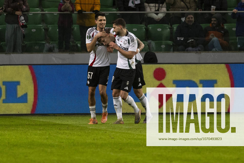 Legia Warszawa - Lincoln Red Imps 18.12.2025 football, Warsaw, UEFA Conference League game Legia Warszawa - Lincoln Red Imps (pilka nozna Liga Konferencji Europy ) image shows: Bartosz Kapustka 9L) Mileta Rajovic (C) goal react photo Katarzyna Plewczynska Fotostyk