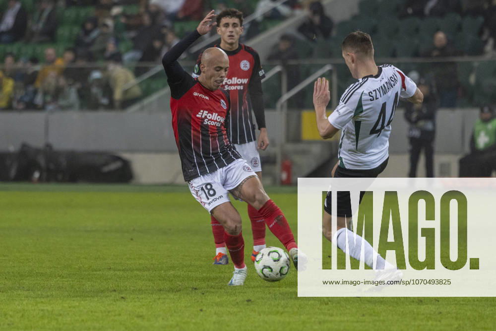 Legia Warszawa - Lincoln Red Imps 18.12.2025 football, Warsaw, UEFA Conference League game Legia Warszawa - Lincoln Red Imps (pilka nozna Liga Konferencji Europy ) image shows: Toni (L) Damian Szymanski (R) photo Katarzyna Plewczynska Fotostyk