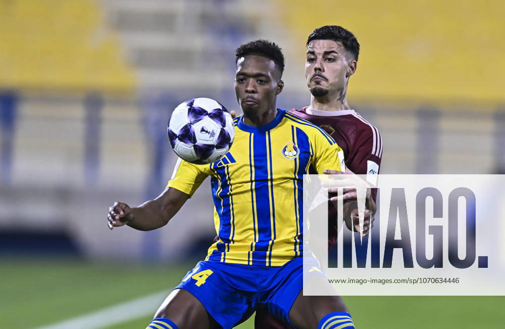 AFC CHAMPIONS LEAGUE ELITE, AL GHARAFA SC V AL WAHDA FC Alvaro Djalo (L) of Al Gharafa SC and Goncalo Moura of Al Wahda FC in action during the AFC Champions League elite west football match between Qatar s Al Gharafa SC and United Arab Emirates Al Wahda FC at Thani Bin Jassim Stadium in Doha, Qatar on December 22, 2025. DOHA Qatar