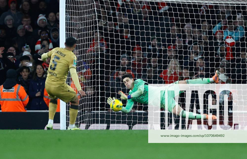 Kepa Arrizabalaga the Arsenal goalkeeper saves the match winning penalty from Maxence Lacroix of Crystal Palace in the penalty shoot out Arsenal v Crystal Palace, Football,Carabao Cup, Emirates Stadium, London, UK - 23 12 25 No use with unauthorised audio, video, data, fixture lists (outside the EU), club league logos or live services. Online in-match use limited to 45 images (+15 in extra time). No use to emulate moving images. No use in betting, games or