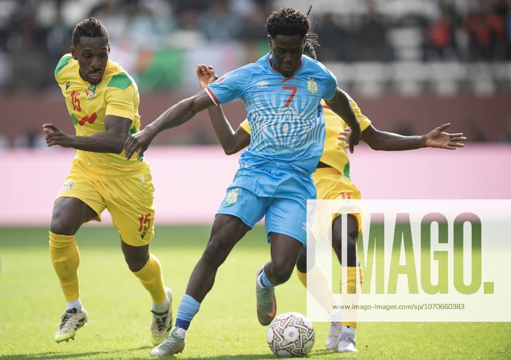 Congo DR v Benin: Group D - Africa Cup Of Nations RABAT, MOROCCO - DECEMBER 23: Nathanael Mbuku of Congo DR (centre) holds off Rachid Moumini and Sessi D Almeida of Benin (left) and during the Africa Cup Of Nations Group D match between Congo DR and Benin at on December 23, 2025 in Rabat, Morocco. Rabat Morocco
