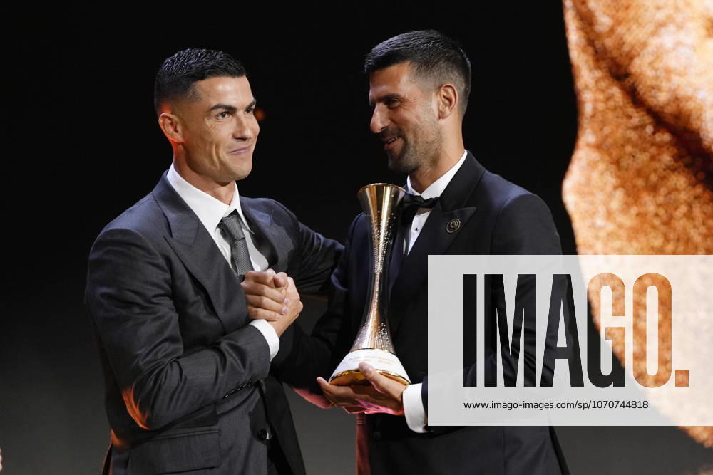 Novak Djokovic receives a prize from Cristiano Ronaldo during the Globe Soccer Awards 2025- 16h edition. in Dubai, UAE - Soccer