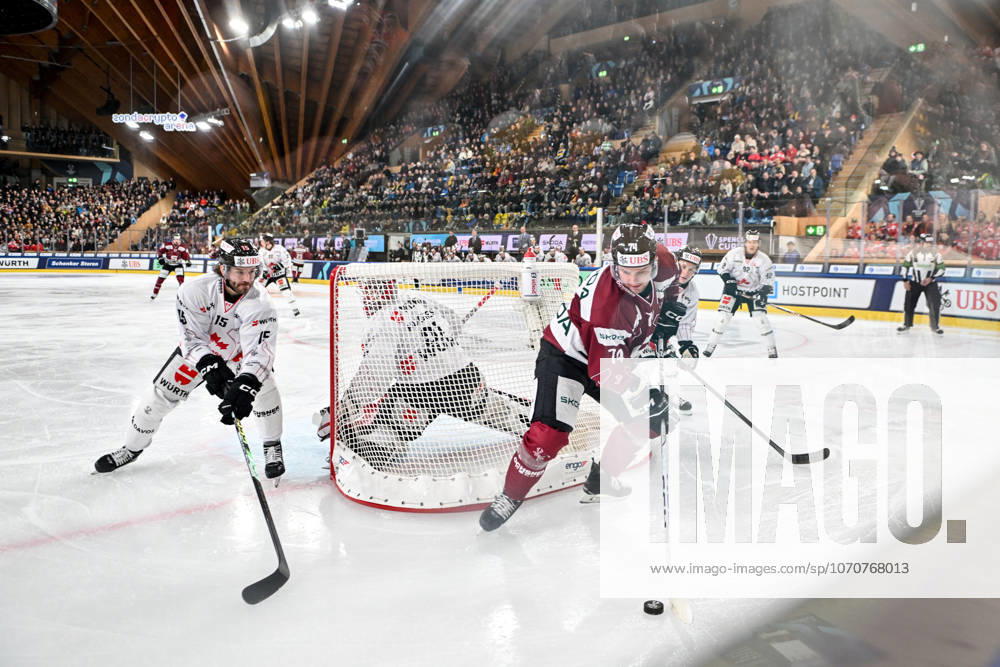 DAVOS, SWITZERLAND DECEMBER 29 Adam Raska of Sparta Praha R in action against Nikolas Brouillard of Team Canada L during the Spengler Cup Davos match between HC Sparta Praha v Team Canada at Zondacrypto Arena on December 29, 2025 in Davos, Switzerland Davos Graubunden Switzerland