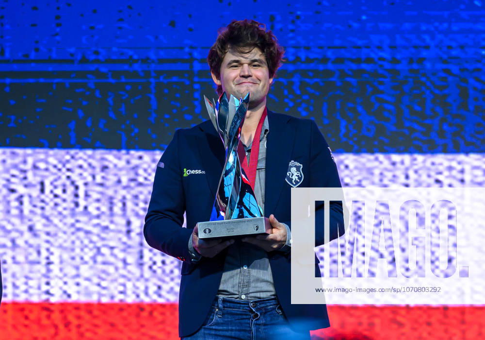 FIDE WORLD RAPID & BLITZ CHAMPIONSHIPS 2025 RAPID FINALS Gold medalist Magnus Carlsen of Norway pose with the trophy on the podium during the medal ceremony for the Rapid open Championship final of the FIDE World Rapid & Blitz Championship 2025 Qatar at the Sports and Events Complex, Qatar University, in Doha, Qatar, on December 30, 2025 DOHA Qatar