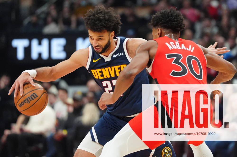 Denver Nuggets guard Jamal Murray (27) tries to get around Toronto Raptors guard Ochai Agbaji (30) during first half NBA, Basketball Herren, USA action in Toronto on Wednesday December 31, 2025. Canada News - December 31, 2025 - ZUMAc35_ 20251231_zaf_c35_048