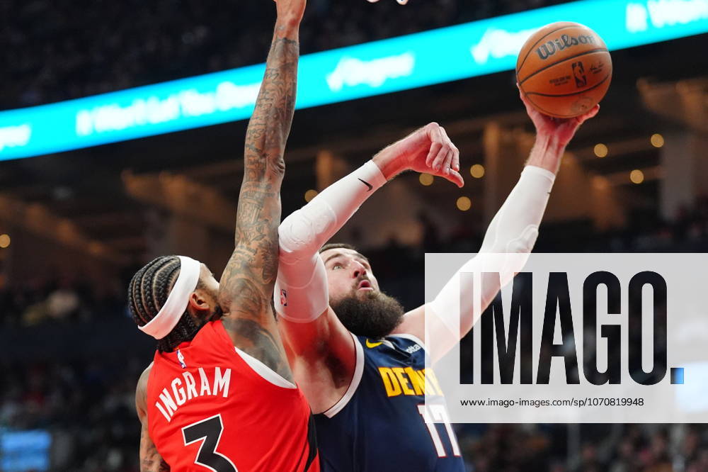 Denver Nuggets centre Jonas ValanÄÂiA«nas (17) jumps towards the basket as Toronto Raptors forward Brandon Ingram (3) defends during first half NBA, Basketball Herren, USA action in Toronto on Wednesday December 31, 2025. Canada News - December 31, 2025 - ZUMAc35_ 20251231_zaf_c35_050