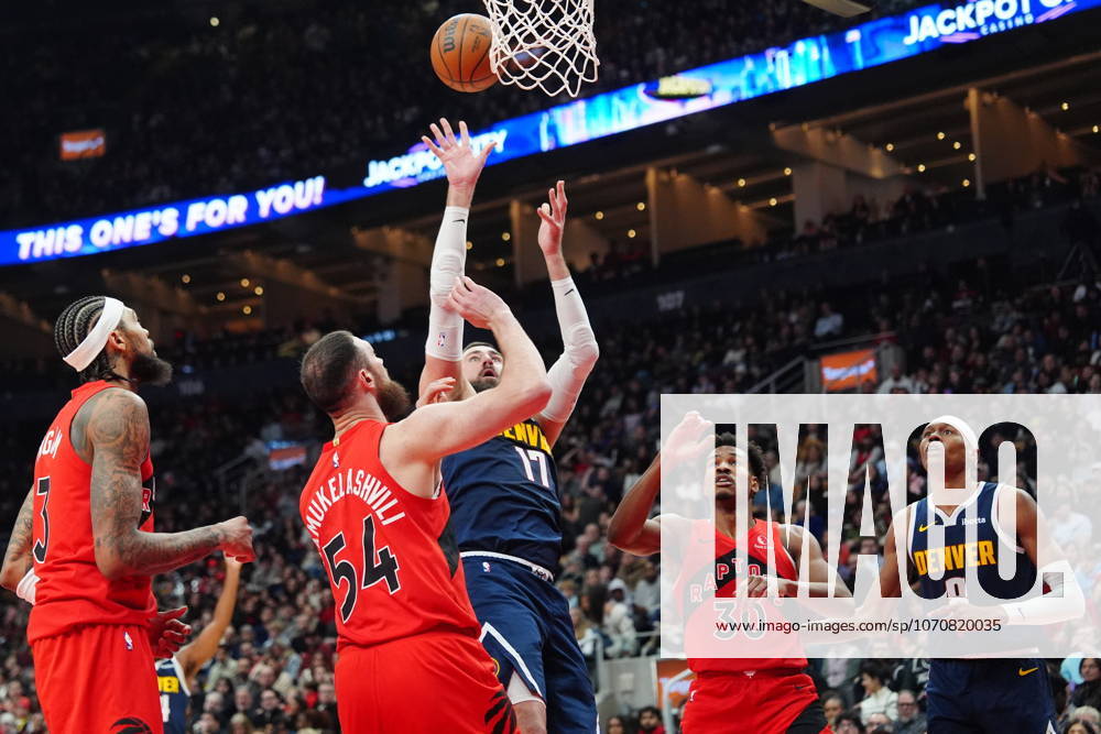 Denver Nuggets centre Jonas ValanÄÂiA«nas (17) shoots over Toronto Raptors Sandro Mamukelashvili (54) during first half NBA, Basketball Herren, USA action in Toronto on Wednesday December 31, 2025. Canada News - December 31, 2025 - ZUMAc35_ 20251231_zaf_c35_053