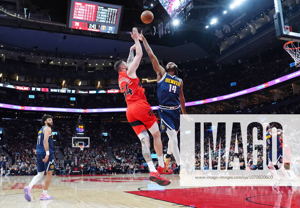 Toronto Raptors forward centre Sandro Mamukelashvili (54) and Denver Nuggets forward Daron Holmes II (14) battle for control of the ball during second half NBA, Basketball Herren, USA action in Toronto on Wednesday December 31, 2025. Canada News - December 31, 2025 - ZUMAc35_ 20251231_zaf_c35_057