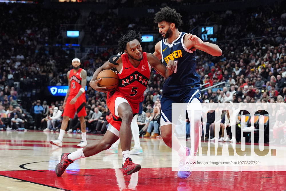 Toronto Raptors guard Immanuel Quickley (5) tries to get around Denver Nuggets guard Jamal Murray (27) during second half NBA, Basketball Herren, USA action in Toronto on Wednesday December 31, 2025. Canada News - December 31, 2025 - ZUMAc35_ 20251231_zaf_c35_069