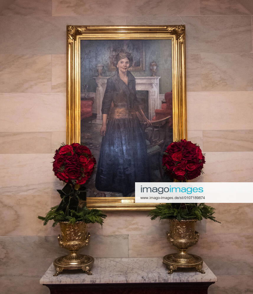 Christmas decorations are seen alongside a portrait of former First Lady Laura Bush in the White House in Washington, DC on Monday, November 30, 2020. This year s theme is, America the Beautiful and is a tribute to the natural wonders of the country. WAP20201130308 KEVINxDIETSCH