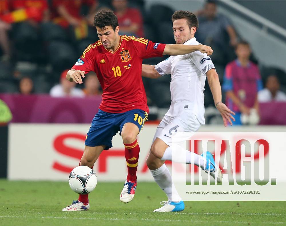 Spain V France, UEFA EURO, EM, Europameisterschaft,Fussball 2012 Quarter Final Cesc Fabregas of Spain and Yohan Cabaye of France challenge during the UEFA Euro 2012 Quarter Final match between Spain and France at Donbass Arena on June 23, 2012 in Donetsk, Ukraine. Donetsk Donbass Arena Ukraine Ukraine