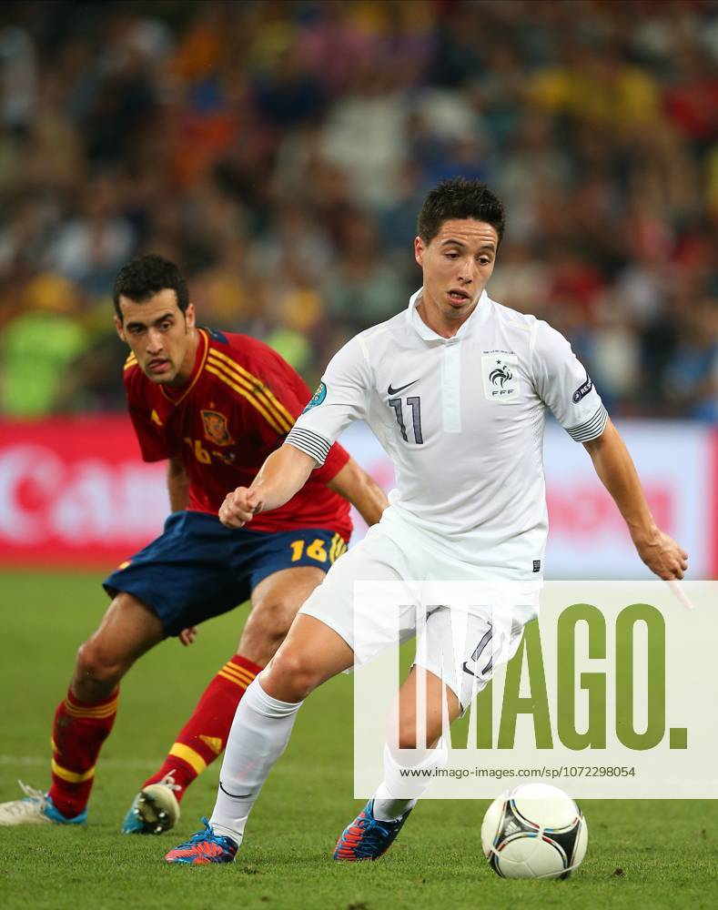 Spain V France, UEFA EURO, EM, Europameisterschaft,Fussball 2012 Quarter Final Samir Nasri of France and Sergio Busquets of Spain on the ball during the UEFA Euro 2012 Quarter Final match between Spain and France at Donbass Arena on June 23, 2012 in Donetsk, Ukraine. Donetsk Donbass Arena Ukraine Ukraine