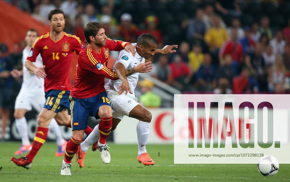 Spain V France, UEFA EURO, EM, Europameisterschaft,Fussball 2012 Quarter Final Sergio Ramos of Spain and Florent Malouda of France challenge during the UEFA Euro 2012 Quarter Final match between Spain and France at Donbass Arena on June 23, 2012 in Donetsk, Ukraine. Donetsk Donbass Arena Ukraine Ukraine