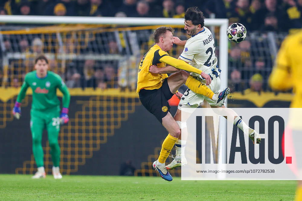 Football, UEFA Champions League, Borussia Dortmund Atalanta Bergamo, BVB Stadion, Play Offs first leg, Season 2025 2026 Maximilian Beier BVB 14 in duel against Sead Kolasinac Atalanta Bergamo 23 Regulations prohibit any use of photographs as image sequences and or quasi video North Rhine-Westphalia Germany