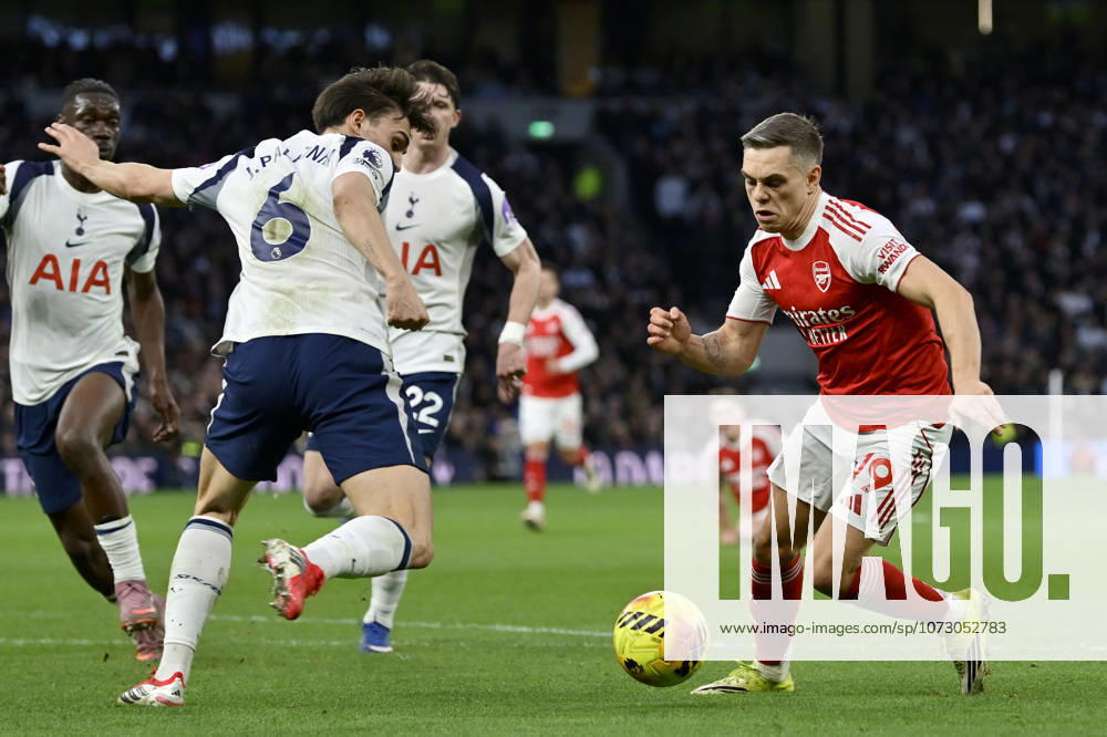 Tottenham Hotspur V Arsenal. Premier League Leandro Trossard (Arsenal) goes past Joao Palhinha (Spurs) during the Tottenham Hotspur V Arsenal Premier League match at the Tottenham Hotspur Stadium, London. Tottenham Tottenham Hotspur Stadium UK