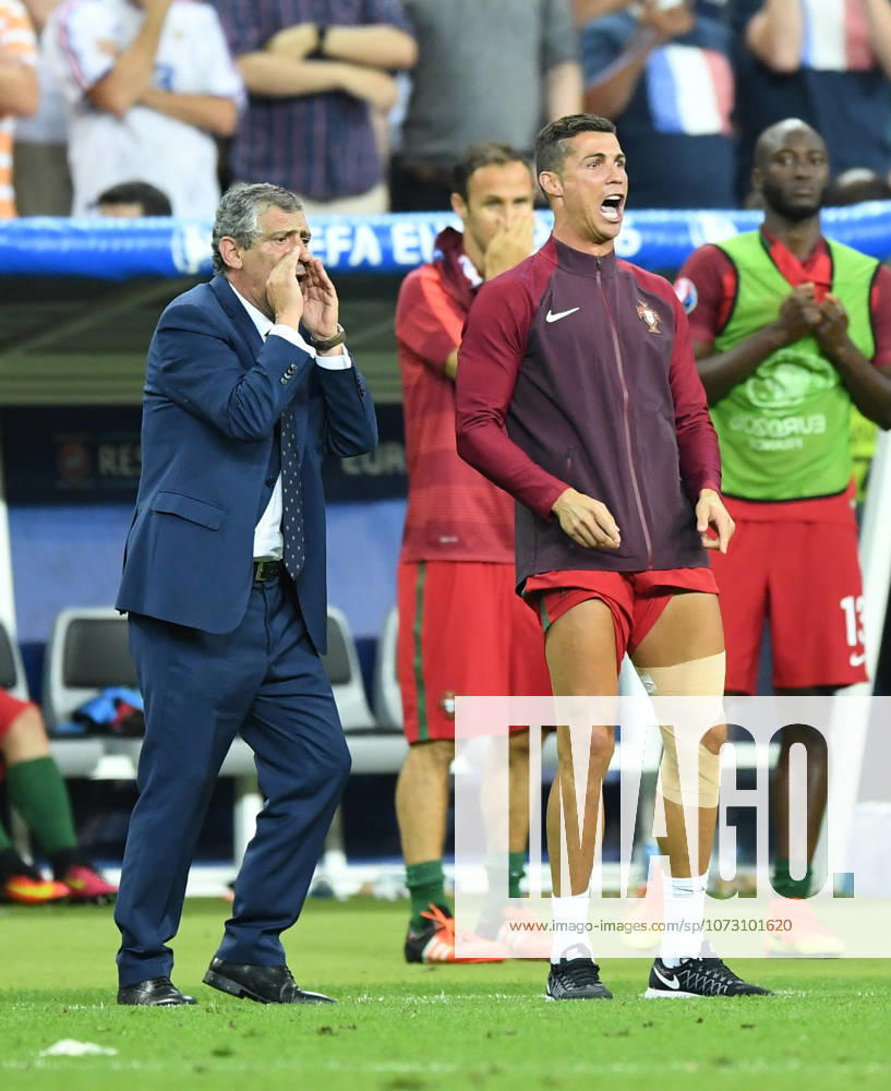 Portugal wins UEFA EURO, EM, Europameisterschaft,Fussball 2016 PARIS, FRANCE - JULY 10: Portugal s Cristiano Ronaldo (R) and head coach of Portugal Fernando Santos are seen during the Euro 2016 final football match between Portugal and France at the Stade de France in Saint-Denis, north of Paris, France on July 10, 2016. Ile-de-France France. Editorial use only. Please get in touch for any other usage.