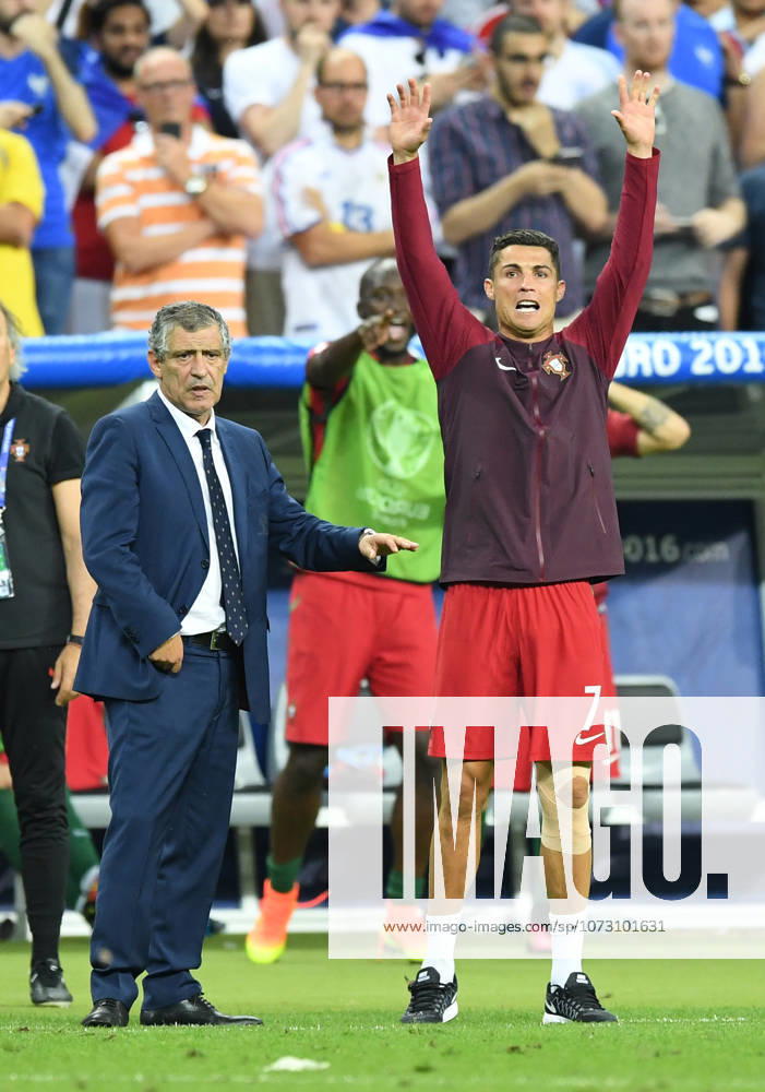 Portugal wins UEFA EURO, EM, Europameisterschaft,Fussball 2016 PARIS, FRANCE - JULY 10: Portugal s Cristiano Ronaldo (R) and head coach of Portugal Fernando Santos are seen during the Euro 2016 final football match between Portugal and France at the Stade de France in Saint-Denis, north of Paris, France on July 10, 2016. Ile-de-France France. Editorial use only. Please get in touch for any other usage.