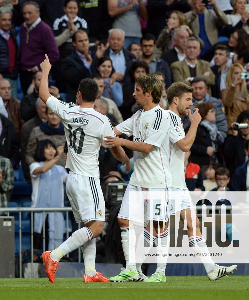 Real Madrid CF v UD Almeria - La Liga MADRID, SPAIN - APRIL 29: James Rodriguez (L) of Real Madrid CF celebrates with his teammates after scoring a goal during the La Liga match between Real Madrid CF and UD Almeria at Estadio Santiago Bernabeu on April 29, 2015 in Madrid, Spain. Evrim Aydin Anadolu Agency Madrid Spain. Editorial use only. Please get in touch for any other usage.