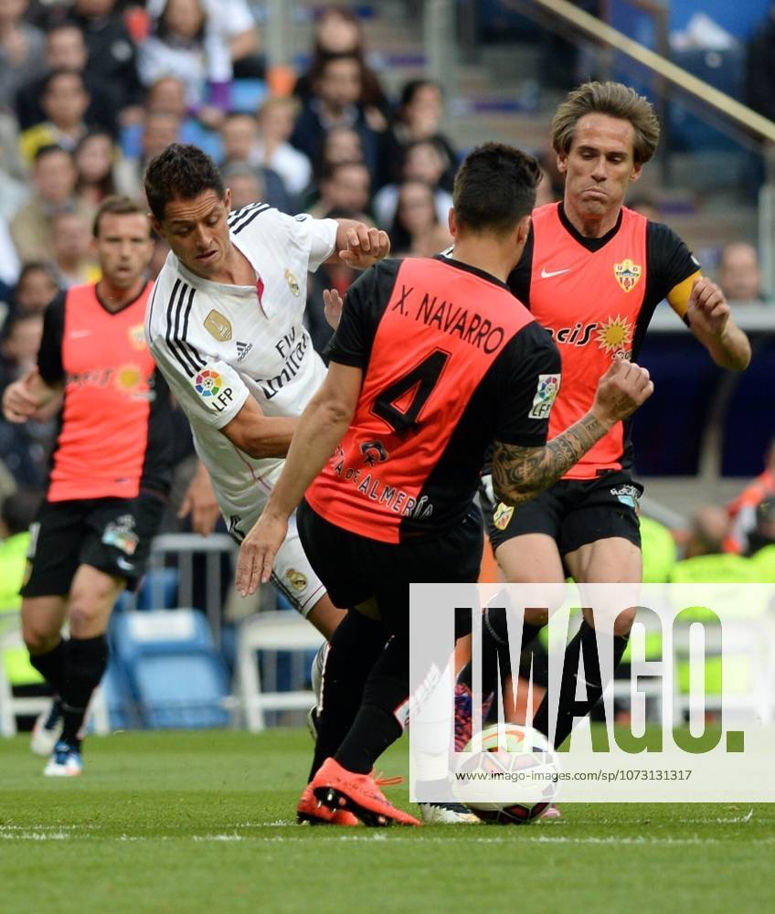 Real Madrid CF v UD Almeria - La Liga MADRID, SPAIN - APRIL 29: Chicharito (L) of Real Madrid CF vies for ball with Ximo Navarro (C) of UD Almeria during the La Liga match between Real Madrid CF and UD Almeria at Estadio Santiago Bernabeu on April 29, 2015 in Madrid, Spain. Evrim Aydin Anadolu Agency Madrid Spain. Editorial use only. Please get in touch for any other usage.
