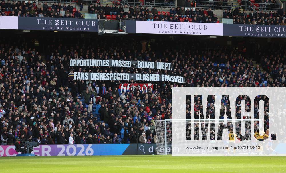 Premier League - Crystal Palace FC v Wolverhampton Wanderers LONDON, ENGLAND, FEBRUARY 21: Crystal Palace fans hold aloft a banner in protest which reads Opportunities Missed, Board Inept, Fans Disrespected, Glasner Finished towards Oliver Glasner Manager of Crystal Palace & Steve Parish, Josh Harris, Woody Johnson co owners of Crystal Palace during the match between Crystal Palace FC and Wolverhampton Wanderers FC in the Premier League at Selhurst Park Stadium in London, England, on February 21. (Photo by Daniel Weir) London Selhurst Park Stadium England