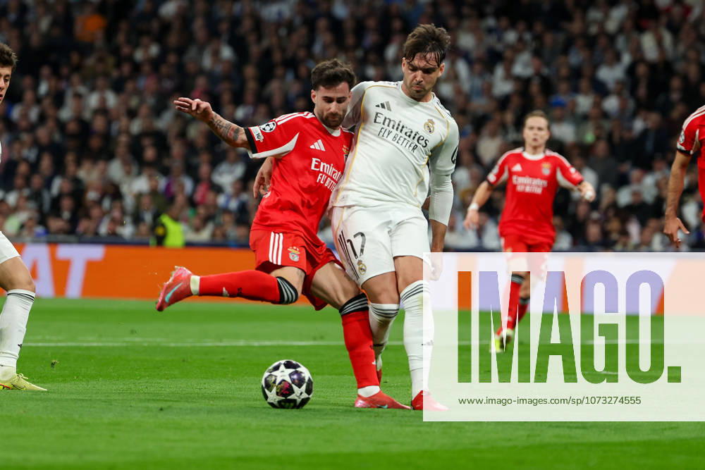 Madrid, Spain February 25, 2026 FBL UEFA Champions League 2025 26 Real Madrid SL Benfica Rafa S L Benfica , Raul Asencio Real Madrid battles for the Ball during the UEFA Champions League 2025 26 knockout play offs match between Real Madrid and SL Benfica at the Santiago Bernabà u Stadium on February 25, 2026 in Madrid, Spain