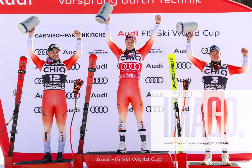 ALPINE SKIING - FIS WC Garmisch-Partenkirchen GARMISCH-PARTENKIRCHEN,GERMANY,28.FEB.26 - ALPINE SKIING - FIS World Cup, downhill, men. Image shows the rejoicing of Alexis Monney (SUI), Marco Odermatt (SUI) and Stefan Rogentin (SUI). Keywords: trophy. GEPAxpictures xHaraldxSteiner