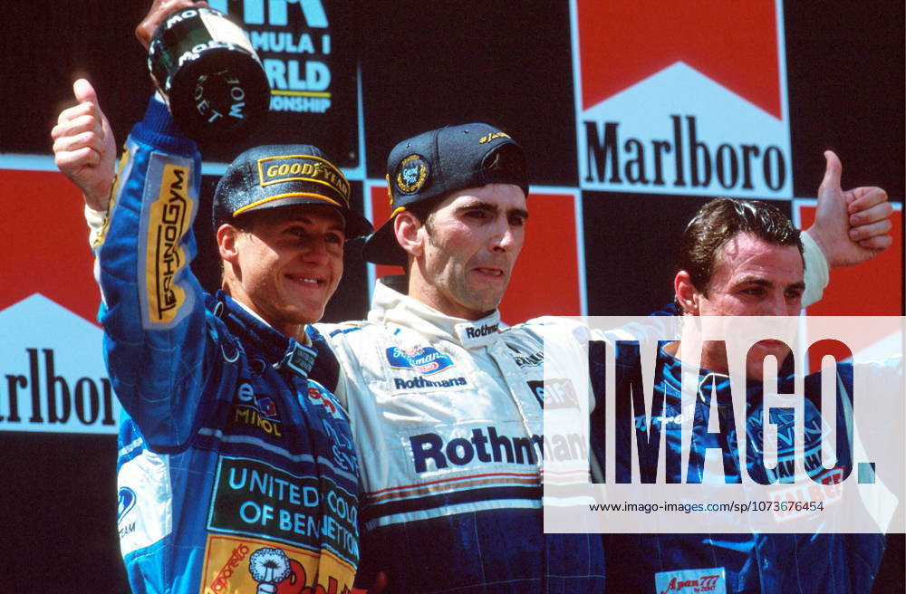 Damon Hill celebrates on the podium with Michael Schumacher and Mark Blundell, right..Spanish GP, Barcelona