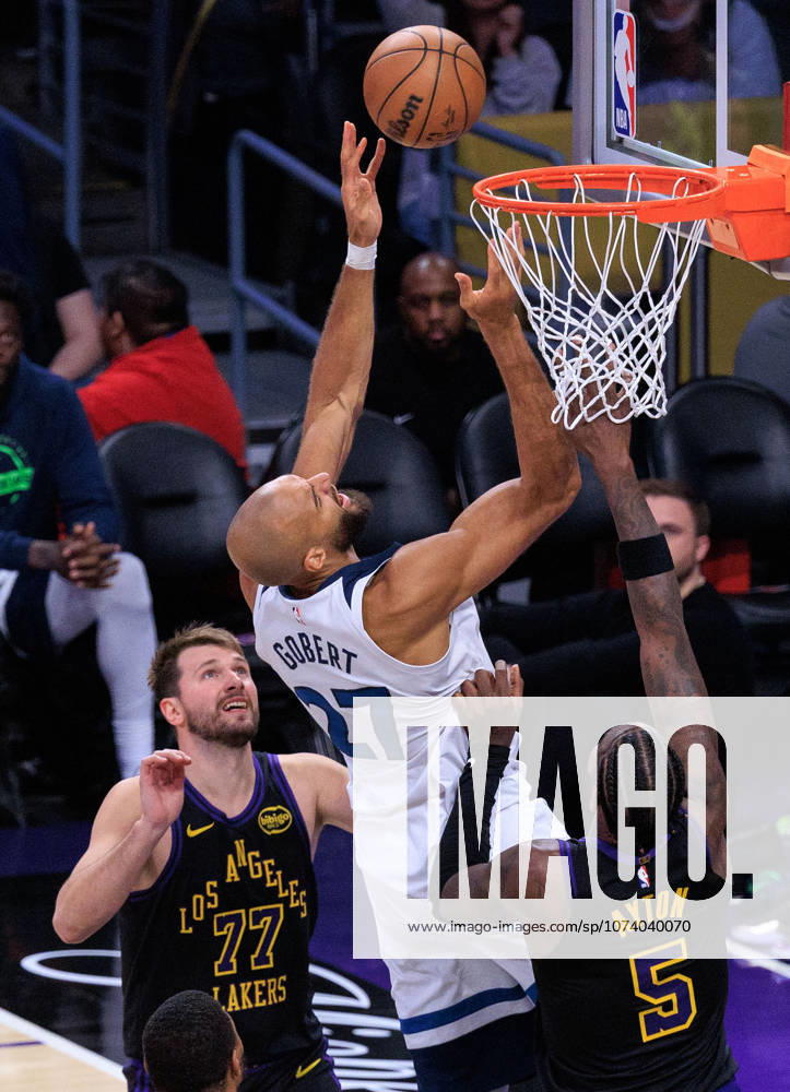 Rudy Gobert 27 of the Minnesota Timberwolves puts up a shot past Luka Doncic 77 and Deandre Ayton 5 of the Los Angeles Lakers during a regular season NBA, Basketball Herren, USA game on Tuesday March 10, 2026 at Crypto.com Arena in Los Angeles, California. JAVIER ROJAS PI Los Angeles USA - ZUMAp124 20260310_zaa_p124_119