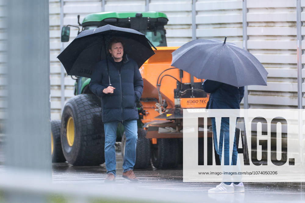 Soccer Training of FC Schalke 04 Director Professional Soccer Youri Mulder FC Schalke 04 with an umbrella Gelsenkirchen Training ground FC Schalke 04 NRW Germany xRHR PHOTO YYx