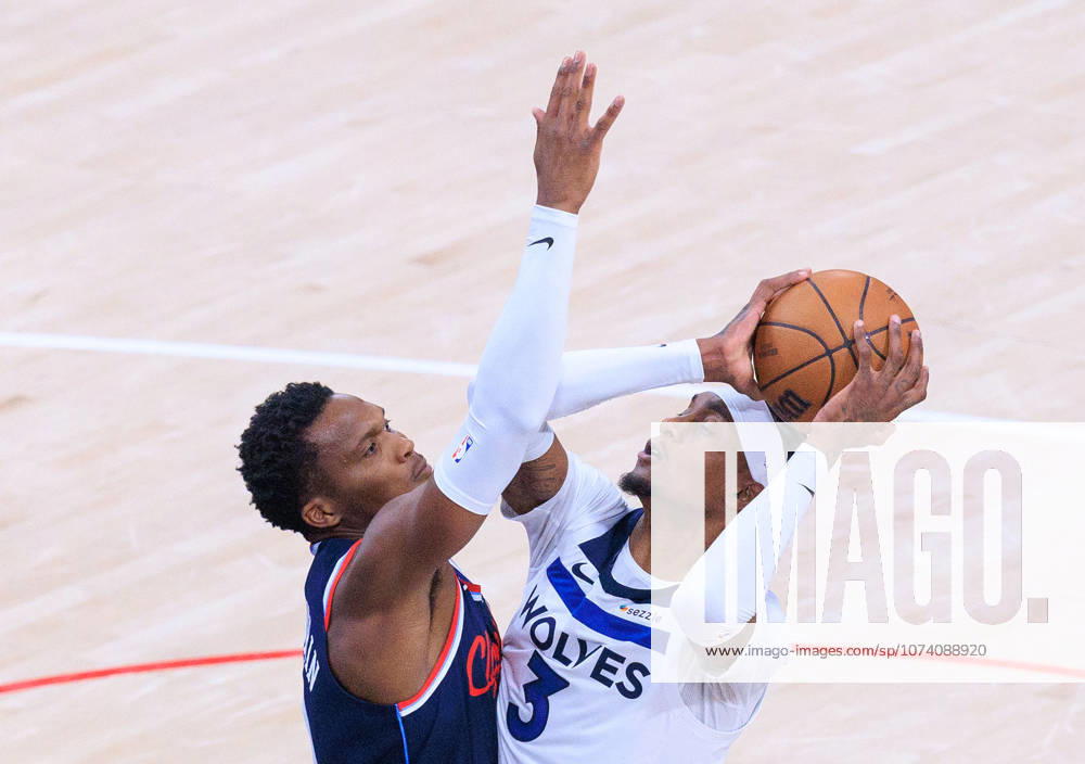 Jaden McDaniels 3 of the Minnesota Timberwolves puts a shot over Bennedict Mathurin 9 of the LA Clippers during a 2026 NBA, Basketball Herren, USA regular season game on Wednesday March 11, 2026 at Intuit Dome Arena in Inglewood, California. JAVIER ROJAS PI Clippers Vs. Timberwolves - ZUMAp124 20260311_zaa_p124_051