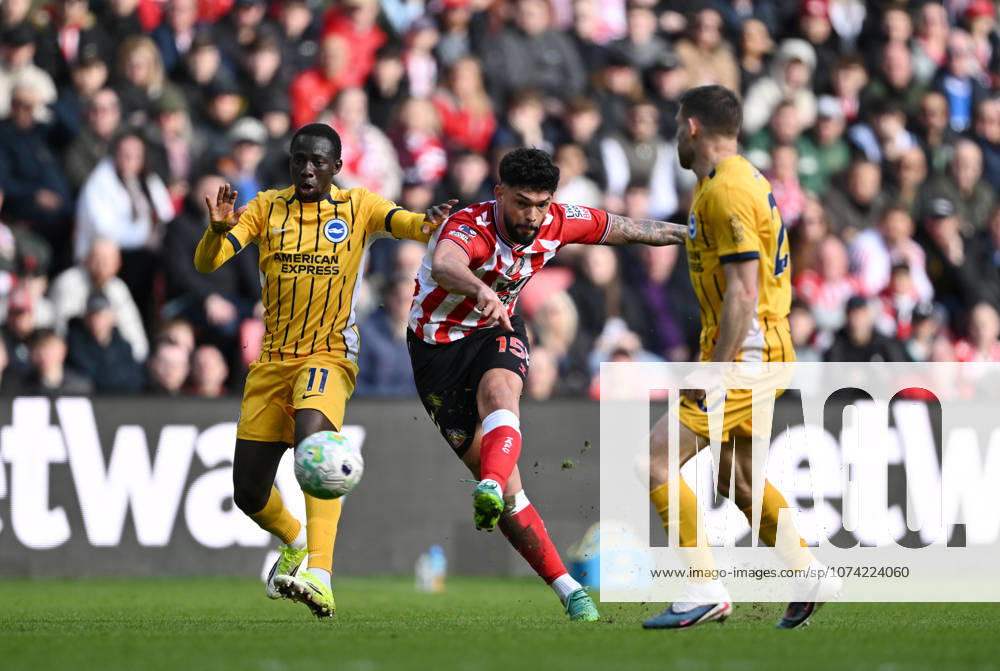 Omar Alderete of Sunderland shoots at goal as Yankuba Minteh of Brighton & Hove Albion tackles Sunderland v Brighton and Hove Albion, Premier League, Football, Stadium of Light, Sunderland, UK - 14 Mar 2026Sunderland Stadium of Light United Kingdom