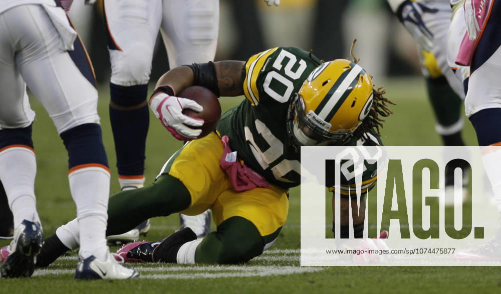 Oct. 2, 2011 - Green Bay, WI, USA - Green Bay Packers running back Alex Green is brought down after an eight-yard run late in the fourth quarter against the Denver Broncos at Lambeau Field in Green Bay, Wisconsin, Sunday, October 2, 2011. The Packers defeated the Broncos, 49-23.