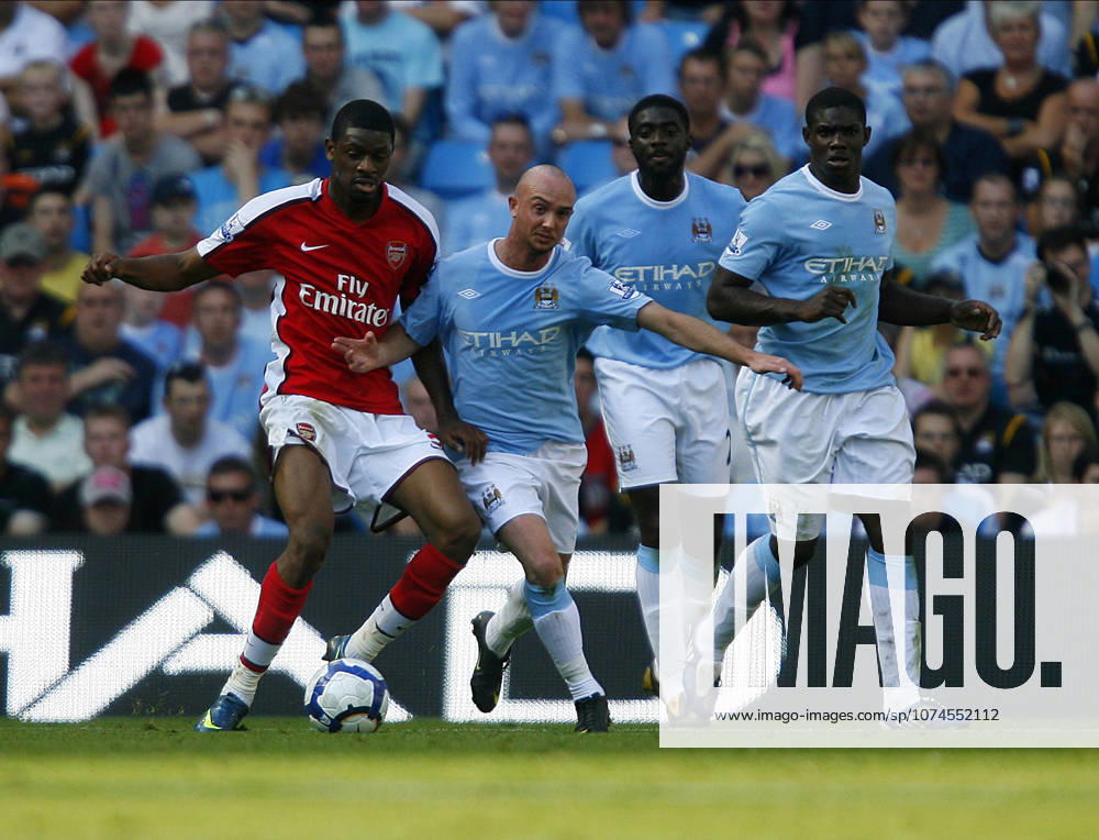 Manchester City V Arsenal, Premier League Abou Diaby of Arsenal and Stephen Ireland of Manchester City challenge during the Premier League match between Manchester City and Arsenal at City Of Manchester Stadium on September 12, 2009 in Manchester, England. Manchester City Of Manchester Stadium England United Kingdom